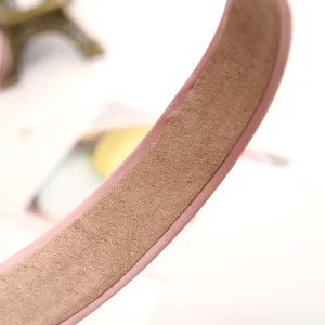 Pink velvet headband detail shot, sweet solid color hair hoop for women and girls daily wear.