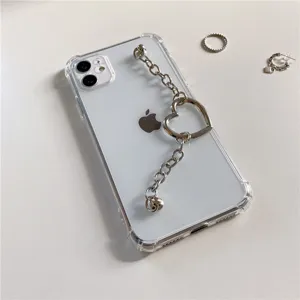 Clear TPU phone case with silver metal chain and heart pendant for iPhone models.