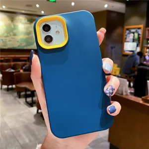 Detailed view of the blue liquid silicone phone case with yellow camera frame protection.