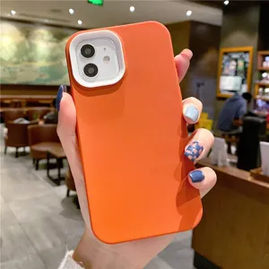Orange silicone phone case with white camera protector compatible with iPhone models.