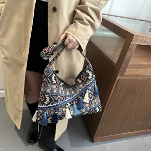 Bolso de hombro de lona estilo étnico retro con patrones geométricos y borlas para uso diario.