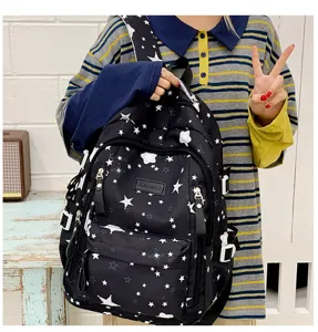 Detailed view of black star print backpack, casual school bookbag for students and daily commuting.