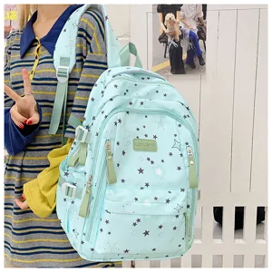 Mint green student backpack detail, large capacity star print design for casual daily use.