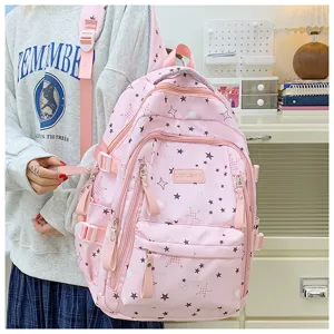 Pink student backpack detail view showcasing large capacity and cute star pattern design.