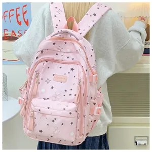 Pink star print school backpack detail showing adjustable straps, pockets, and hardware.
