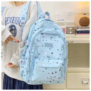 Large capacity light blue student backpack with star print, casual school bag for daily use.