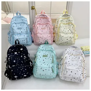 Close-up detail shot of multi-color star pattern school backpacks with spacious compartments.