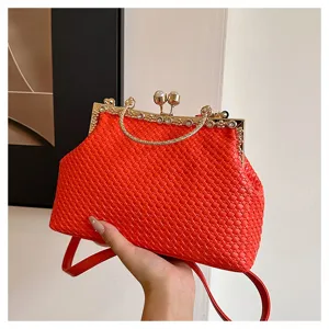Red woven kiss-lock evening bag with pearl rhinestone handle, stylish women's shoulder bag.