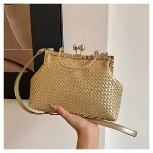 Elegant gold woven evening clutch bag with frame clasp and shoulder strap for women.