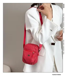 Red plaid mini crossbody phone bag detail view, lightweight casual shoulder bag for women.