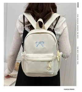 Japanese sweet casual backpack for students, minimalist design with cute bow embroidery.