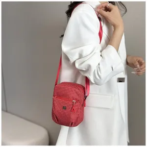 Red checkered crossbody bag for women, lightweight nylon shoulder bag with zipper pocket.