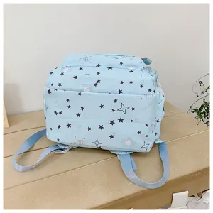 Casual light blue star pattern student backpack, daily school bag detail view for girls.