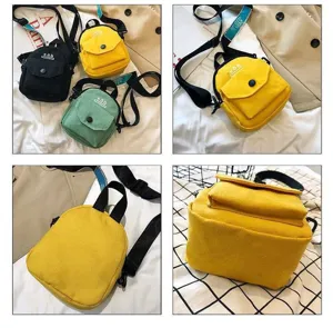 Detail view of cute canvas crossbody bag featuring front pocket and adjustable strap design.