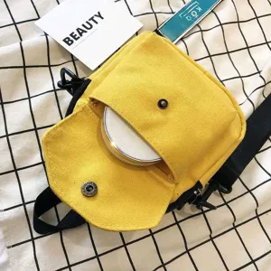 Yellow canvas crossbody bag with front pocket and shoulder strap, casual daily shoulder bag for women.