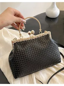 Black woven kiss-lock evening bag with gold handle and pearl clasp for women daily commuting.
