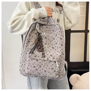 Grey corduroy backpack with cute bow heart print, embroidery letters and hanging charms.