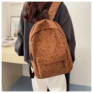 Brown corduroy backpack for women, cute bow and heart print school bookbag for travel.