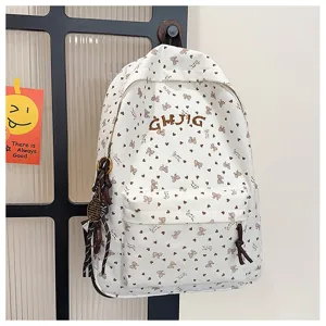 Corduroy bow print casual backpack for women, cute daily school bookbag with front pocket.