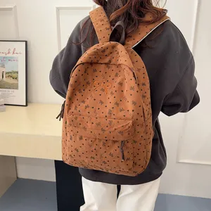 Corduroy backpack for women featuring cute bow print and front embroidery, casual daily use.