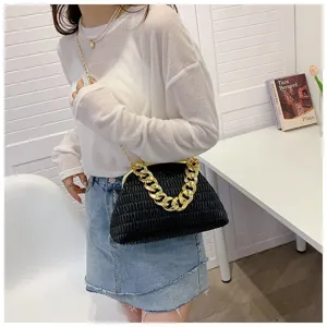 Stylish black pleated crossbody bag with chunky gold chain strap for women. Versatile daily use.