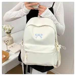 Japanese sweet white backpack with cute blue bow embroidery for students daily use