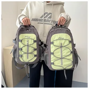 Grey light green contrast color backpack, casual outdoor travel dual shoulder bag detail.