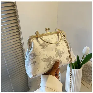 Elegant Chinese style brocade shoulder bag with vintage metal frame, butterfly embroidery.