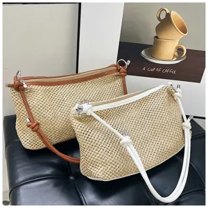 Woven straw shoulder bag for women, contrast leather trim, stylish summer beach crossbody bag.