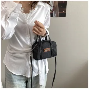 Retro dunkles Jeansstoff Kissen Handtasche mit oberen Henkeln und Umhängeband für Damen Mode.