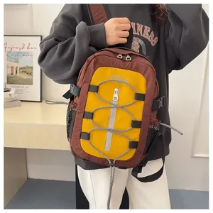 Casual colorblock backpack with bungee cord design, stylish and lightweight for travel.