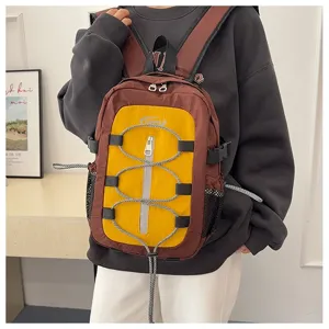 Stylish color-block backpack casual travel daypack with front bungee cord and mesh pockets.