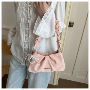 Pink ruched cloud underarm shoulder bag for women, stylish niche design with pearl decor.