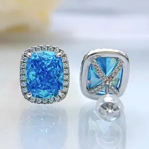 Atemberaubende kanten-blaue Edelstein Halo Ohrringe mit funkelnden Zirkon-Pavé-Fassungen.