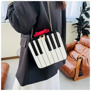 Piano key design detail view showing the unique black and white keyboard pattern and chic red bow accent.