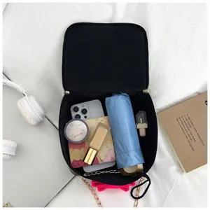 Interior view of the mini chain crossbody bag, showing spacious daily essentials storage.