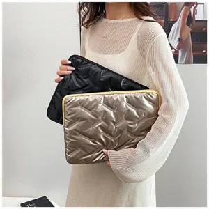 Detail shot of glossy quilted PU large capacity clutch bag, soft envelope document pouch.