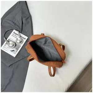 Casual large capacity shoulder bag detail, showing interior lining and commuter travel style setup.