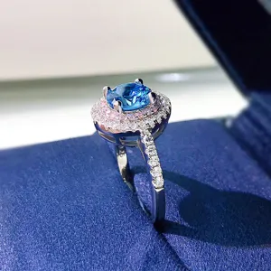 Close-up view of the double halo blue and pink crystal ring detail showcase with micro pavé.