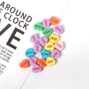 Colorful polymer clay heart beads with love text, ideal for DIY handmade bracelets and necklaces.