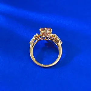Close-up detail of S925 gold plated ring featuring a stunning padparadscha-style center stone.