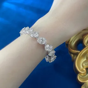 Stunning S925 silver oval cubic zirconia tennis bracelet detail view, sparkling jewelry.