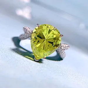 Pear cut olive green high carbon diamond ring in s925 silver with sparkling pave stones detail