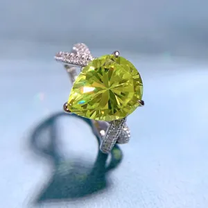 Stunning pear-shaped olive green high carbon diamond ring in S925 silver, sparkling split shank design.