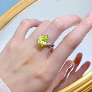 Detailed close-up of a stunning S925 silver olive green pear-shaped cubic zirconia ring.