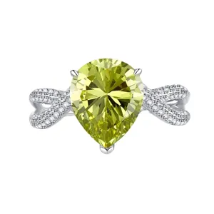 Stunning pear-cut olive green high carbon diamond ring in 925 silver with elegant pave band.