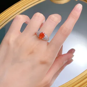Detailed view of s925 silver 7x9mm oval sunset orange simulated diamond ring for women.