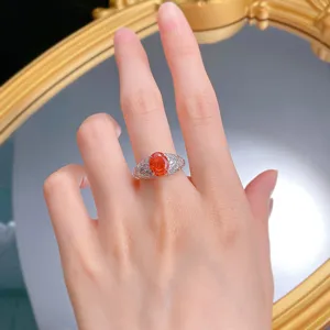 Close-up view of a 7x9mm oval sunset orange simulated diamond ring in S925 sterling silver.