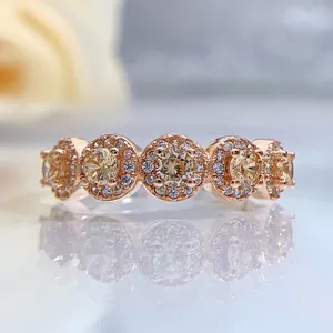 Close-up detail of a stunning rose gold multi-stone cluster ring with sparkling champagne stones.