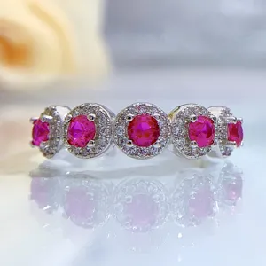 Detailed view of a sparkling S925 silver ring featuring vibrant pink and white stones.